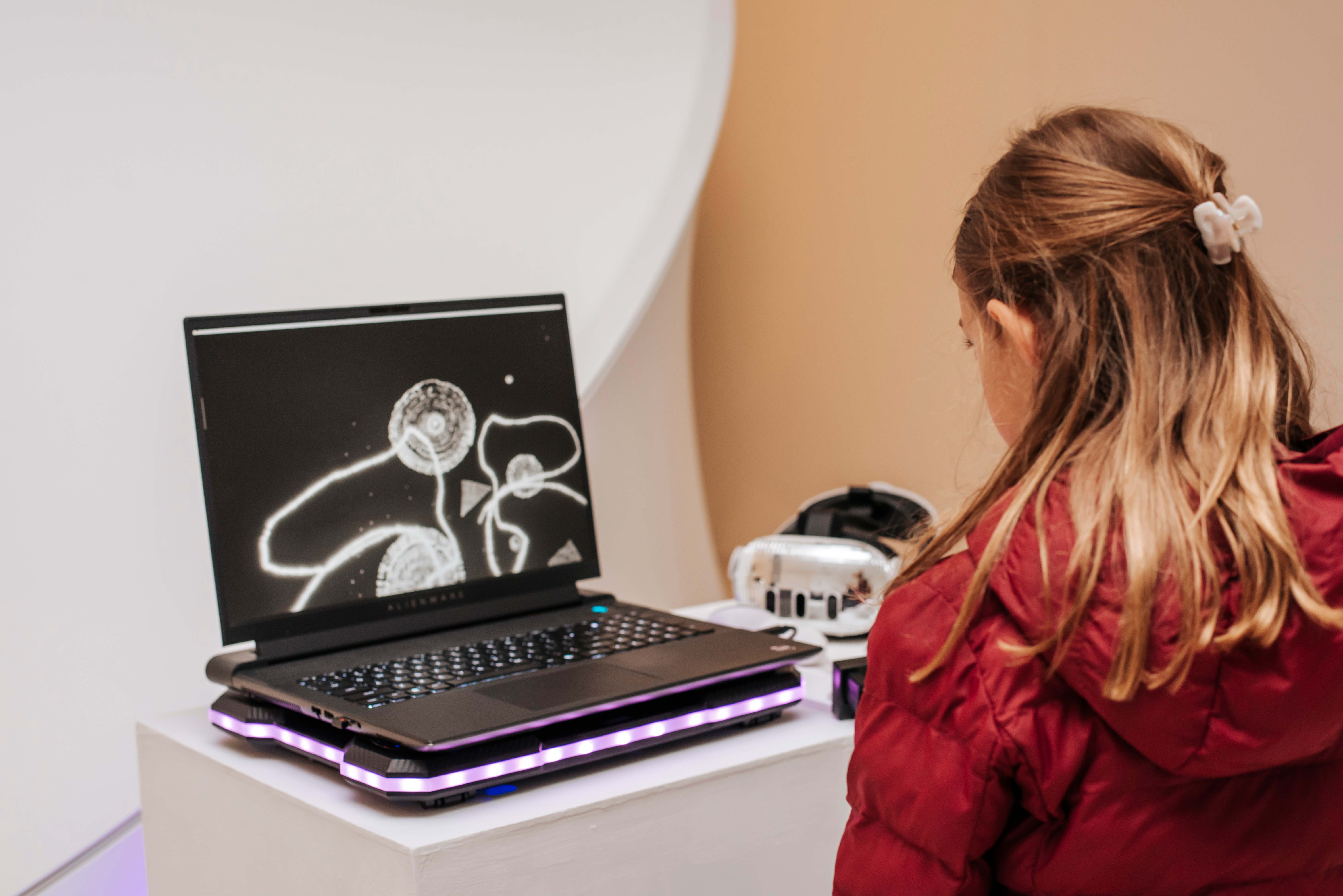 Child using VR drawing application