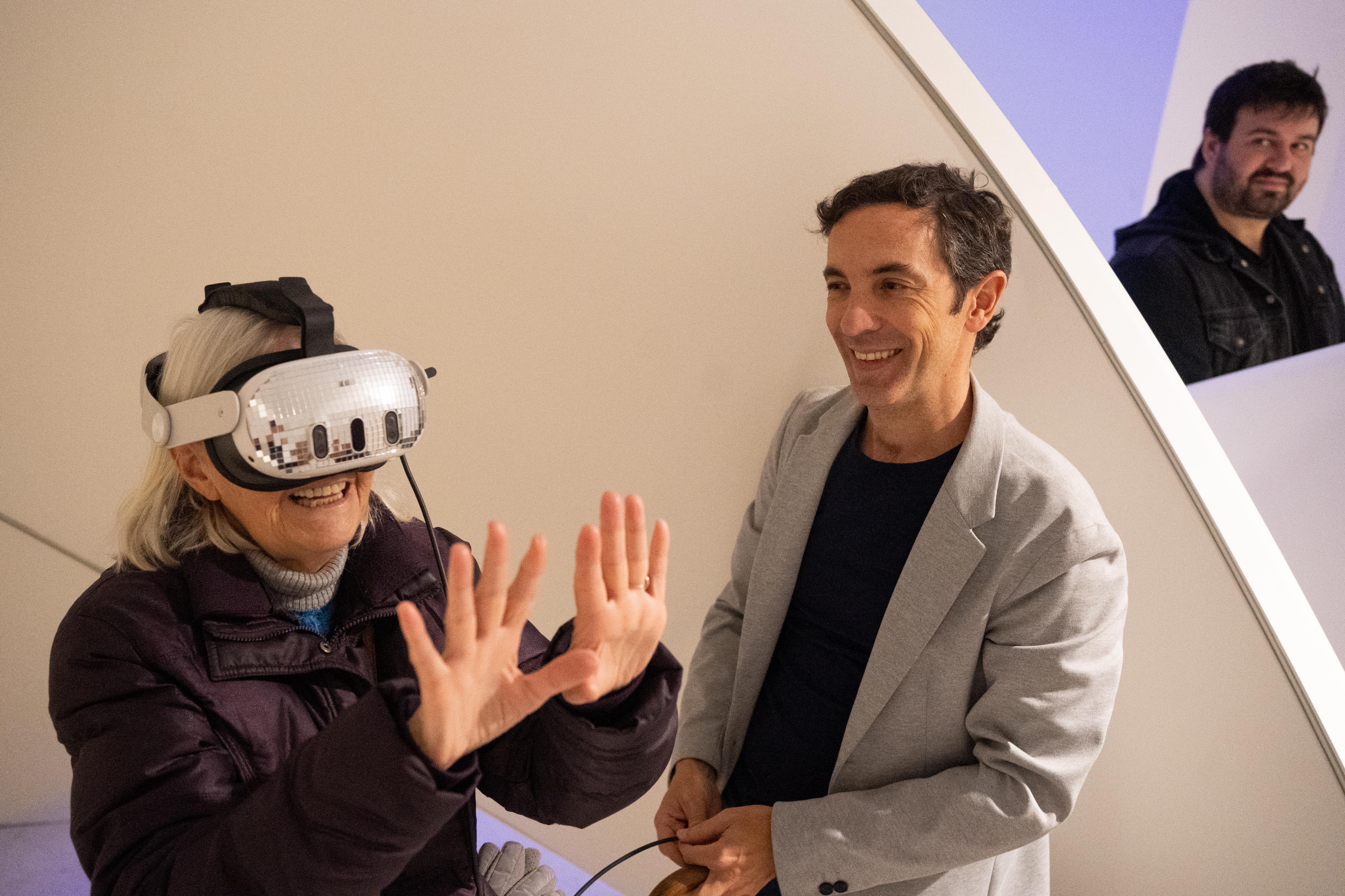 Visitors with artist at exhibition